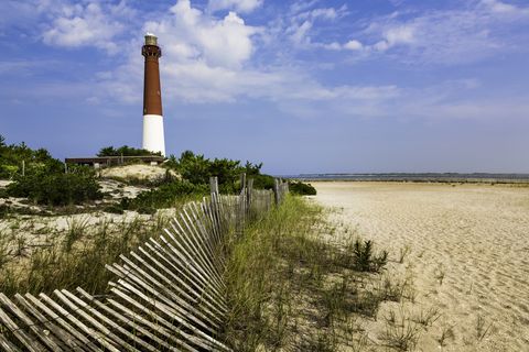 barnegat lighthouse, sand, beach, dune fence, new jersey