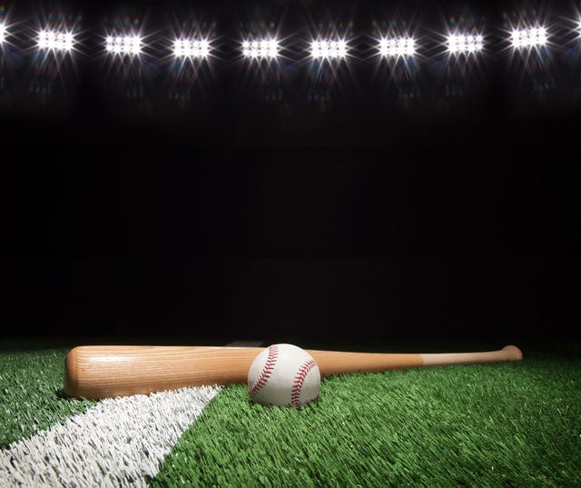 a baseball and a ball on the ground