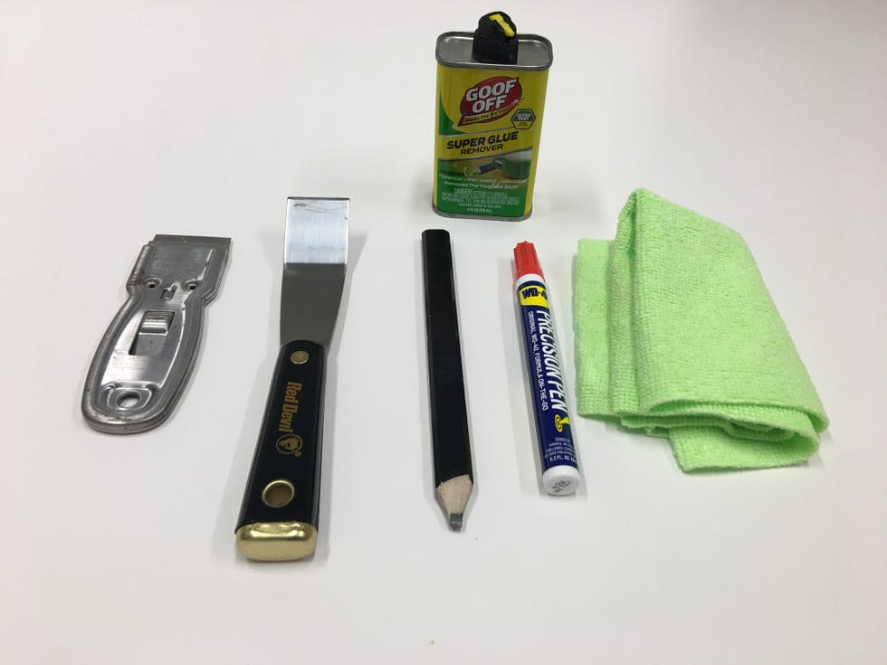 an assortment of tools used for sticker removal