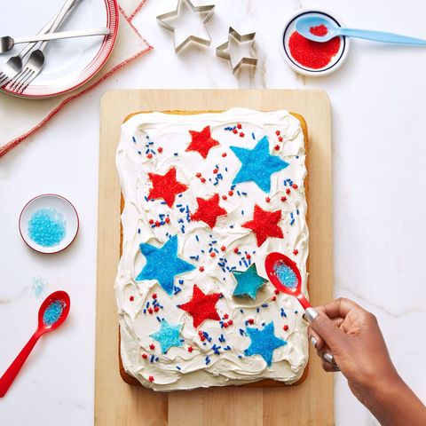vanilla cake with white frosting and blue and red stars on top
