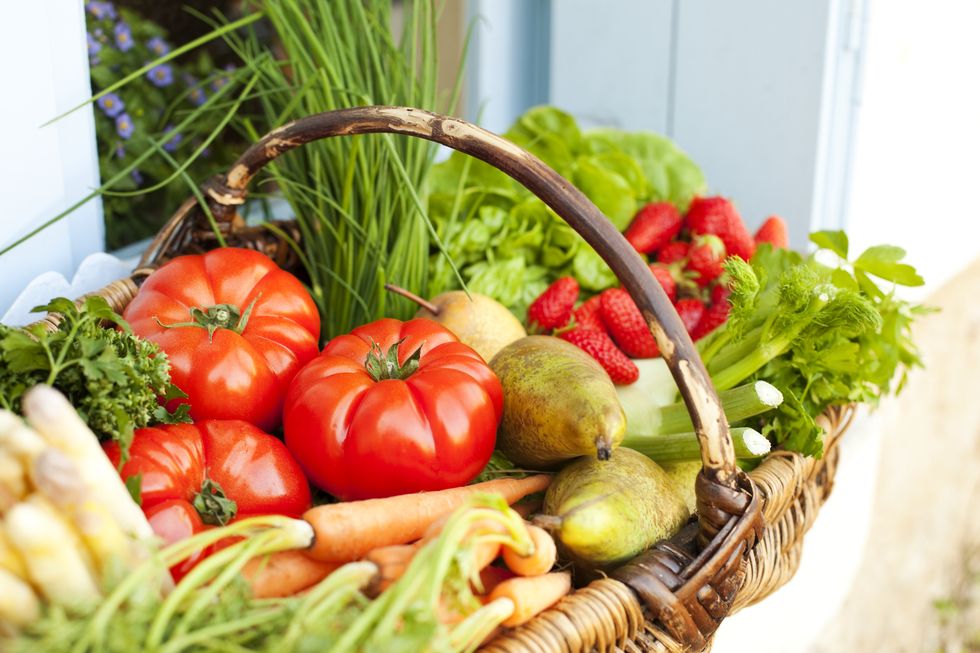 basket full of fresh fruit and vegetables