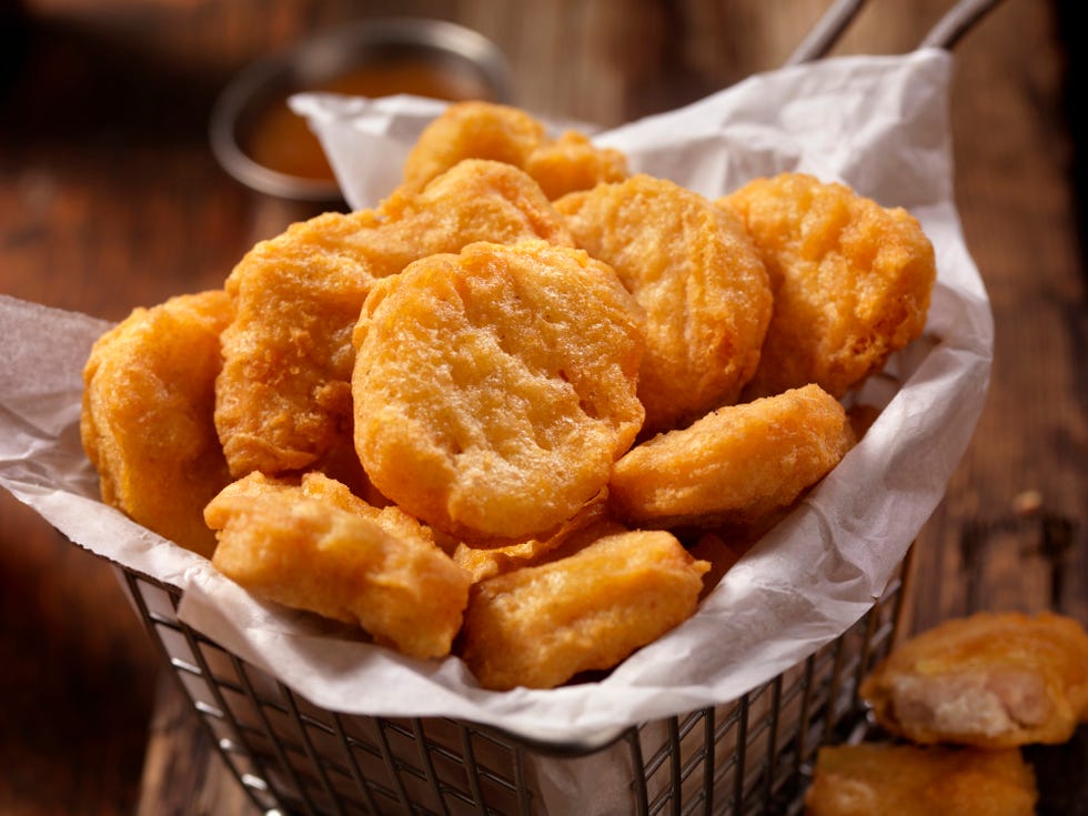 basket of chicken nuggets with sweet and sour sauce