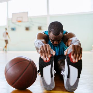 Basketball player stretching