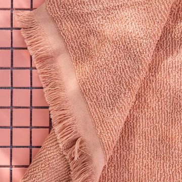 pink bath towel on tile