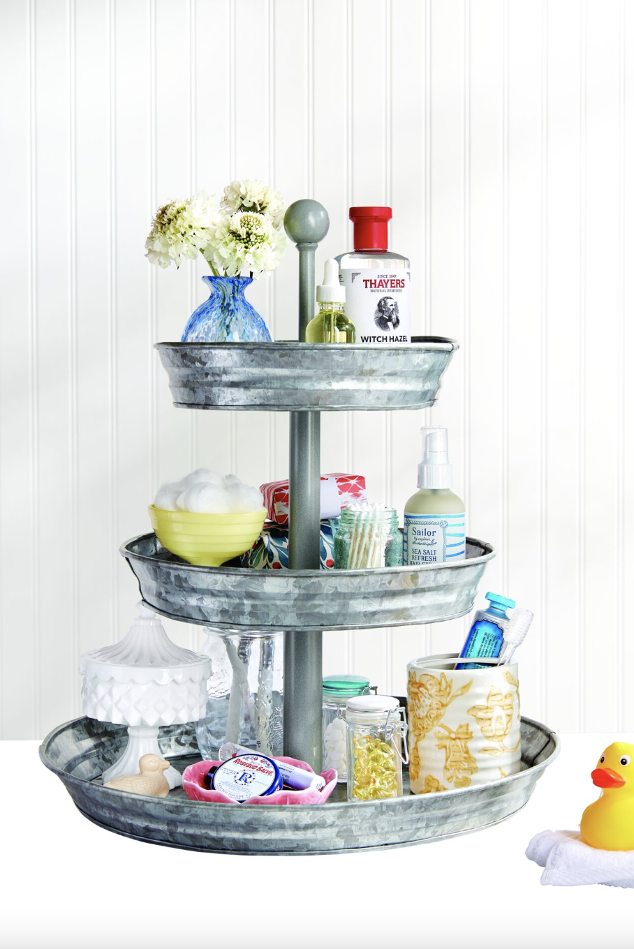 bathroom storage ideas, face products on a three tier stand