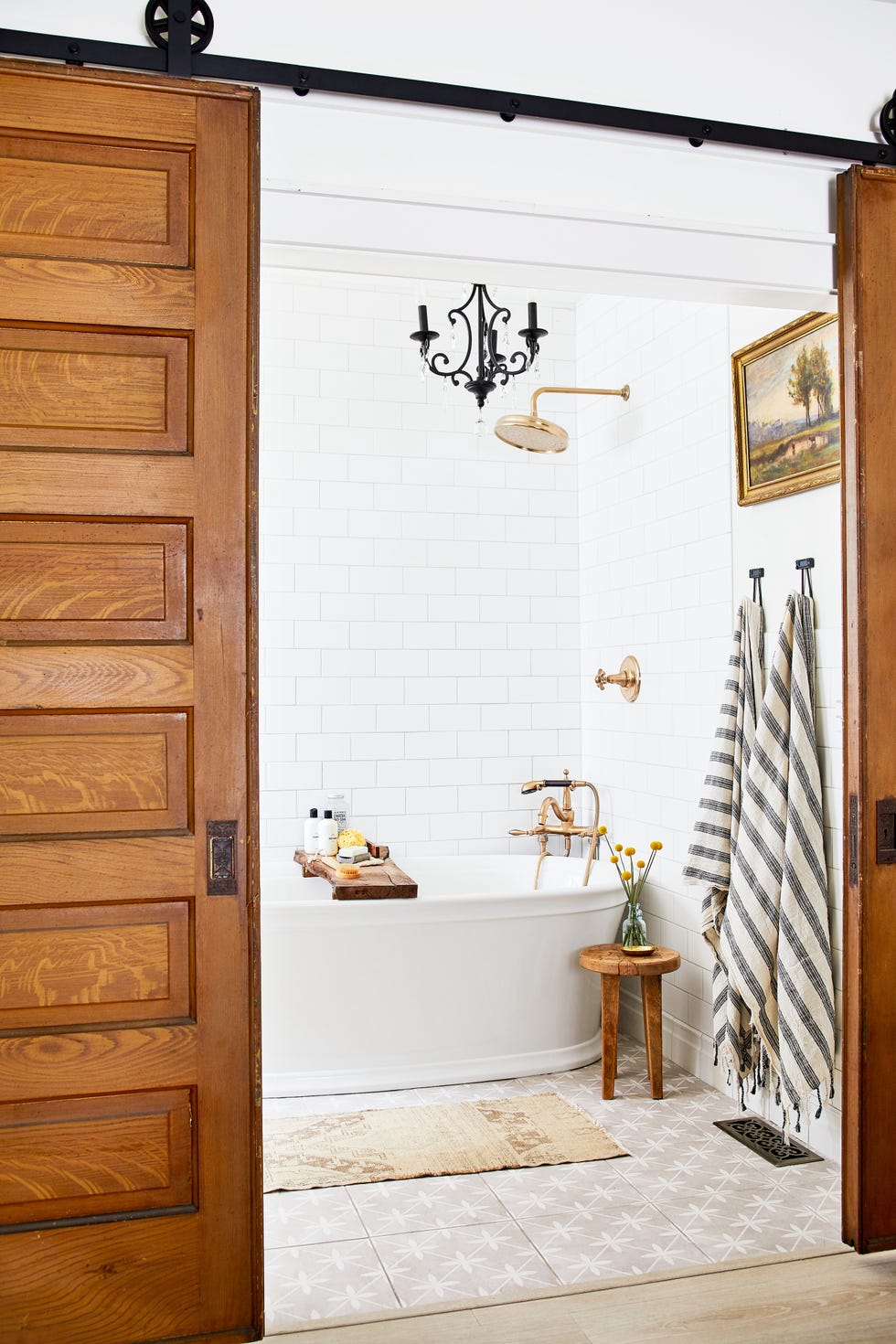 white farmhouse bathroom with rustic barn door