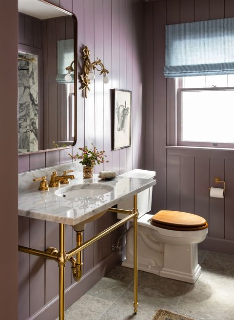 purple bathroom with gold accents