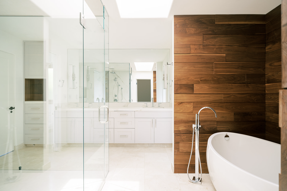 white bathroom with wood wall