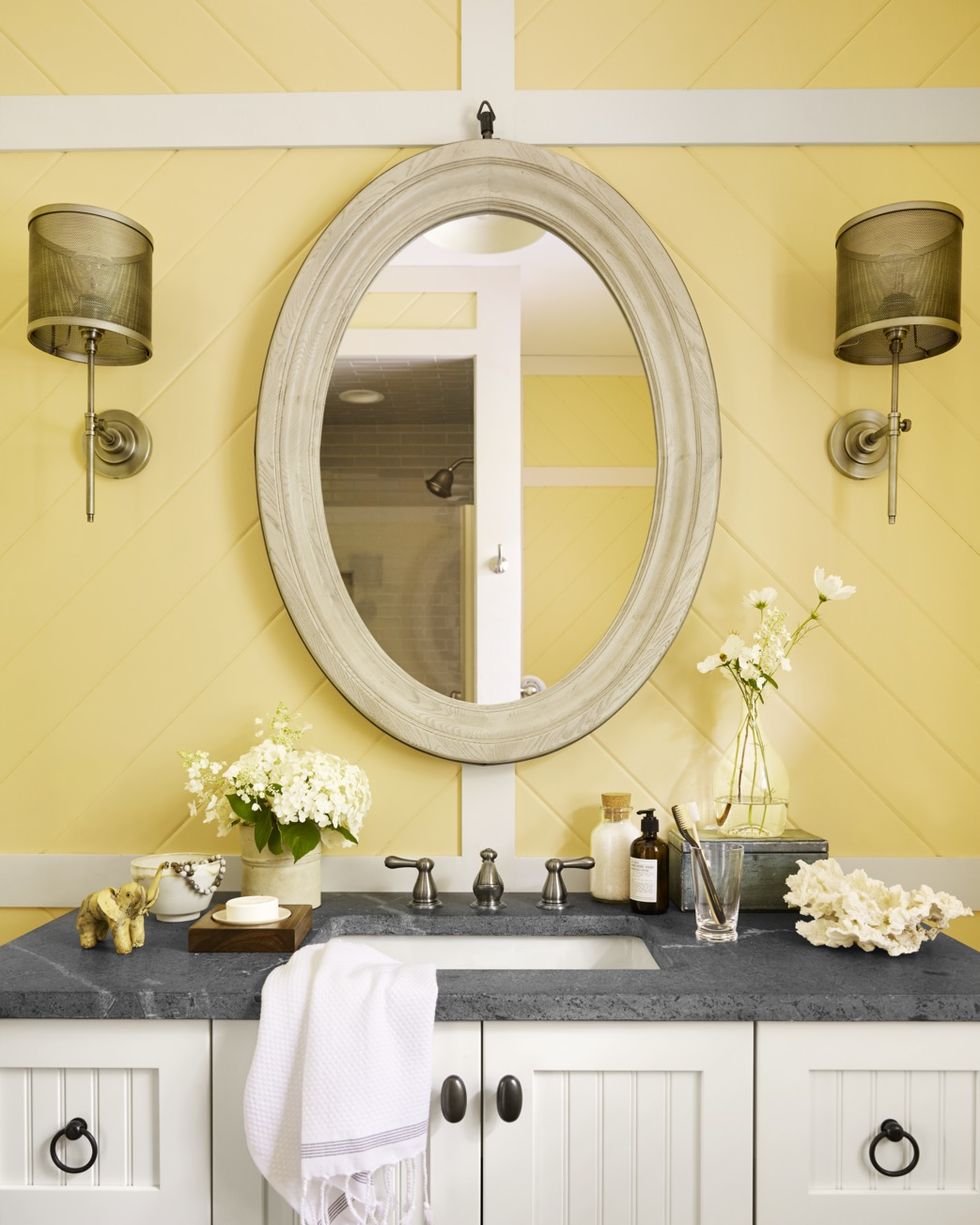 yellow bathroom with mixed metals