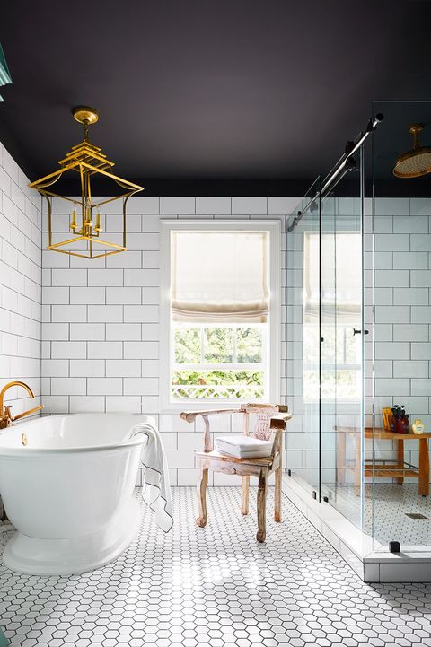 white bathroom with black painted ceiling