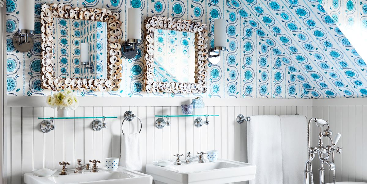 white preppy bathroom with blue wallpaper