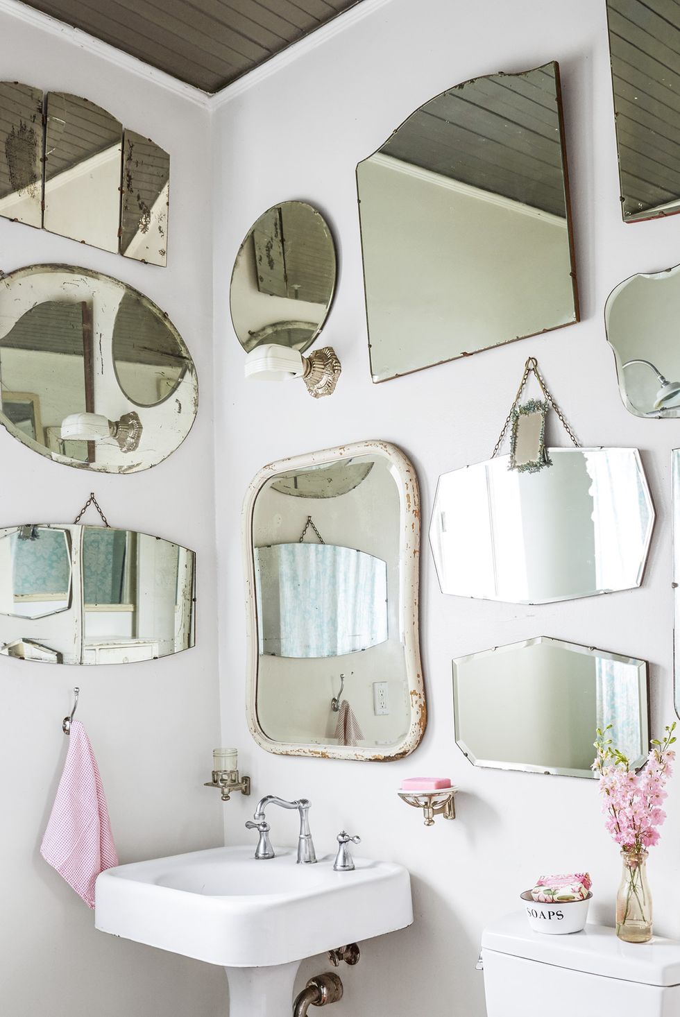 How do I mount a few shelves on a bathroom mirror?