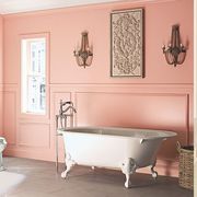 bathroom paint colors, coral bathroom with a white tub and yellow powder room with a white sink