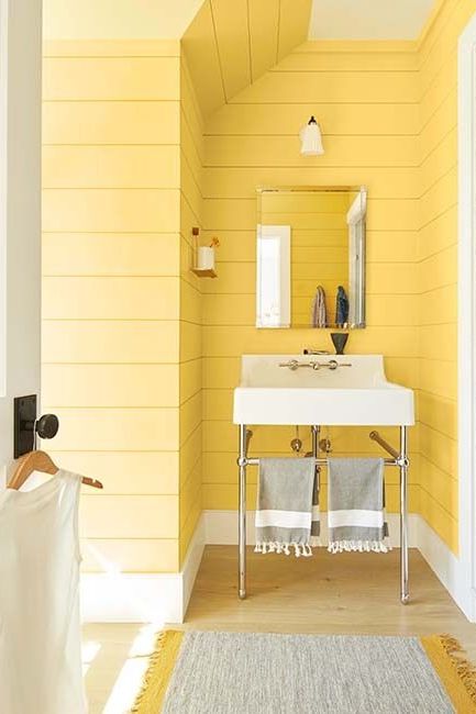 bathroom paint colors, bright yellow bathroom with a white sink and silver mirror