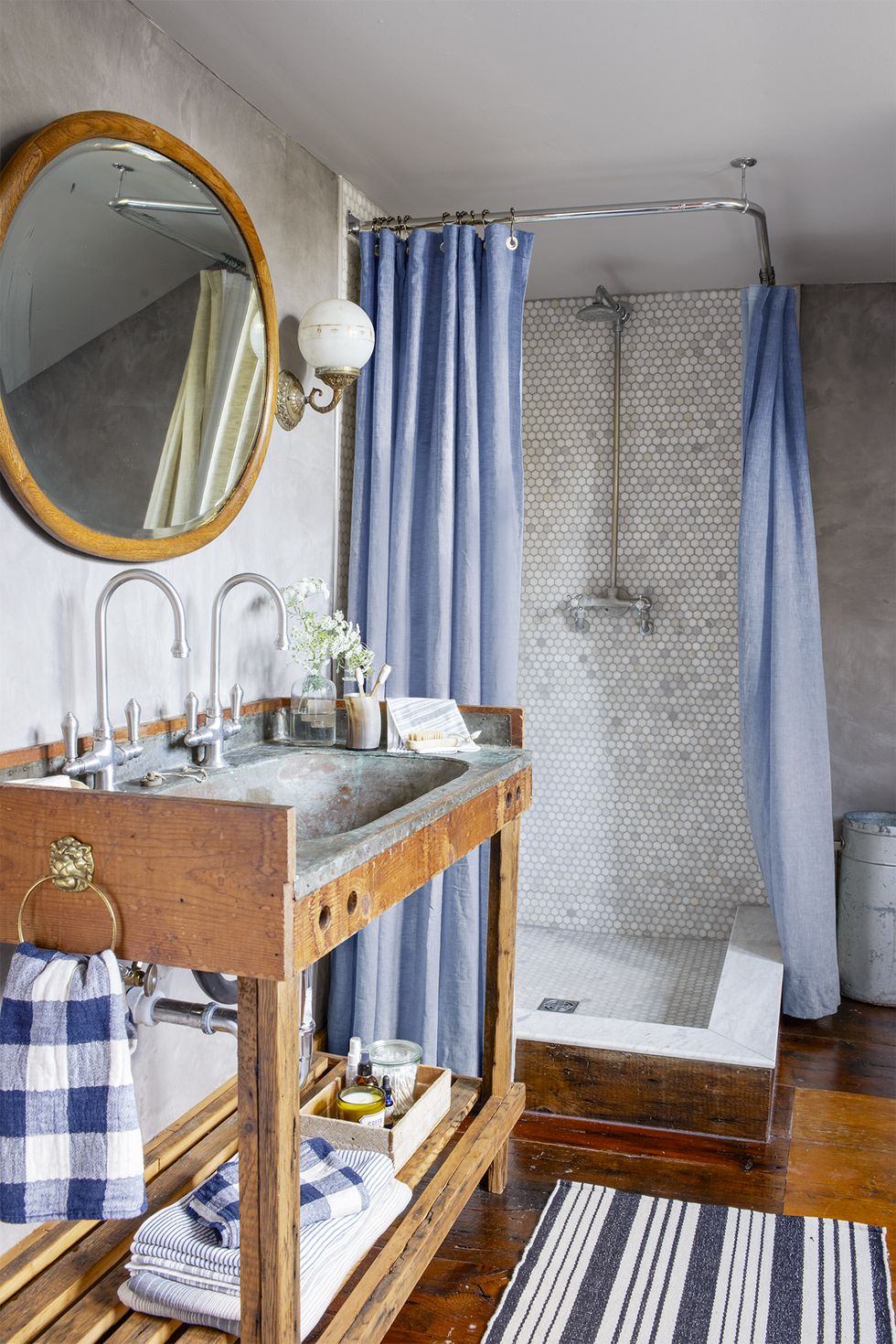 bathroom shelf ideas, bathroom with a walk in shower and blue curtains, with a rustic style sink that has a shelf underneath