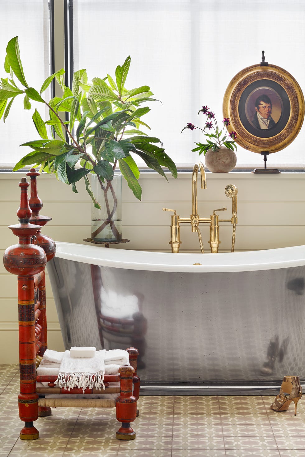 bathroom with metallic tub