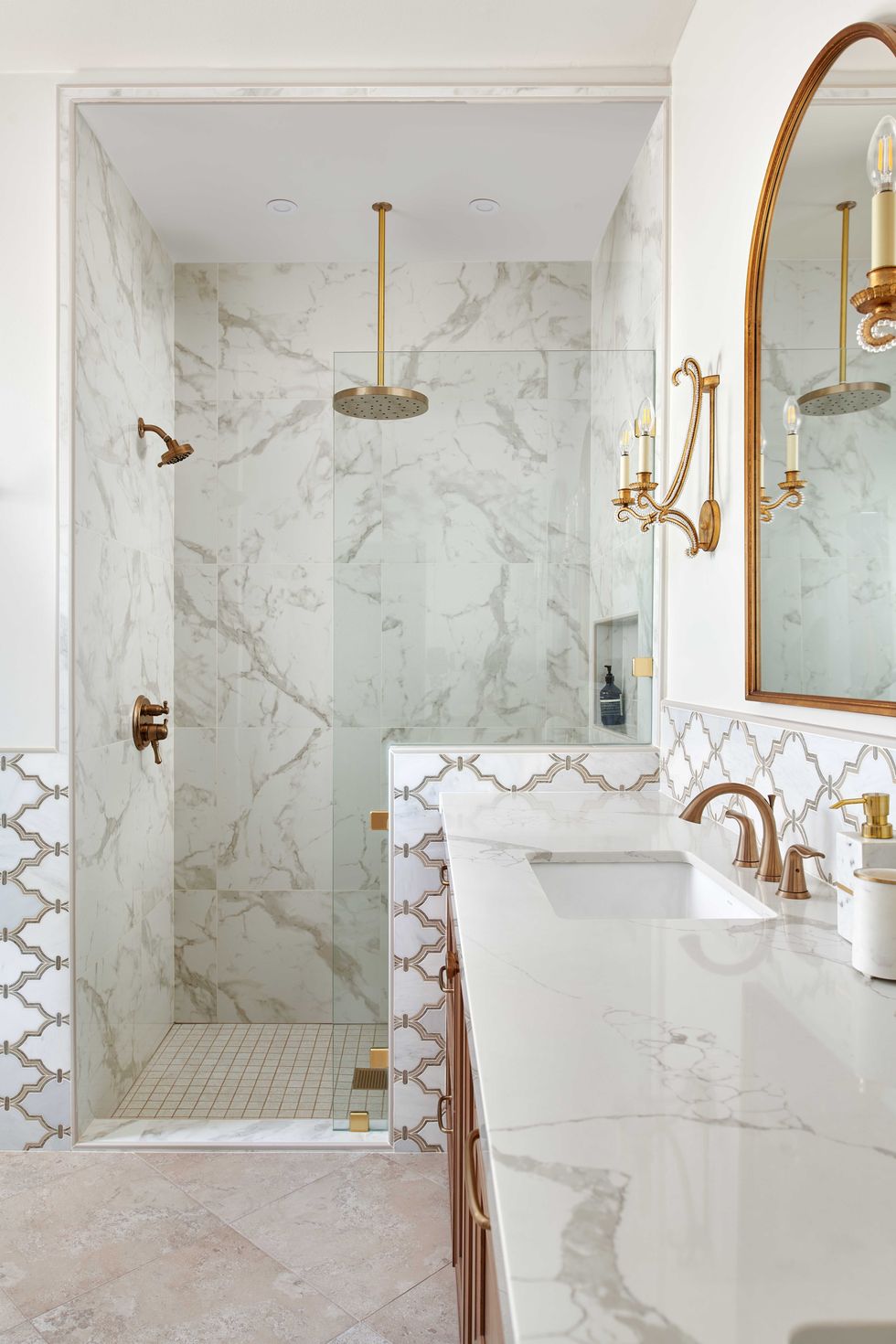 shower, marble countertops, gold faucets, gold mirrors, gold sconces