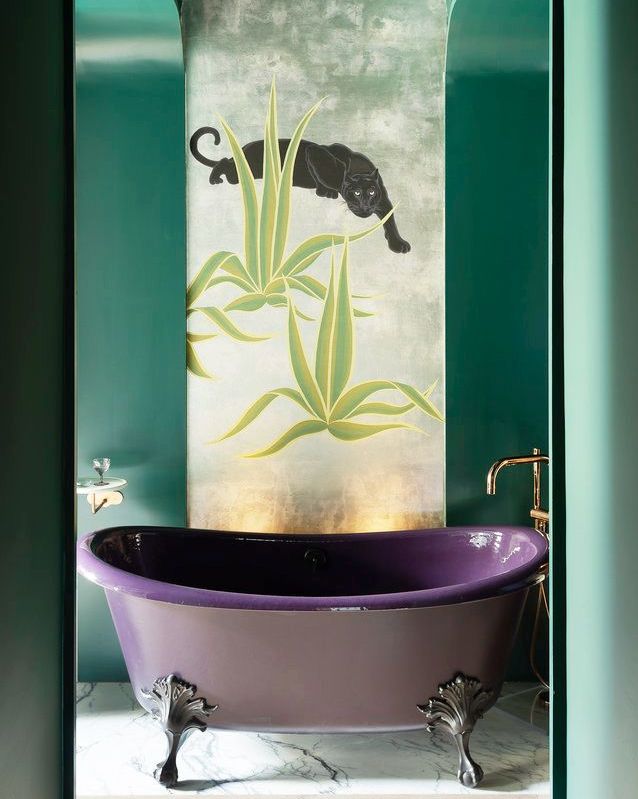 sexy bathroom with purple tub and mural wallpaper