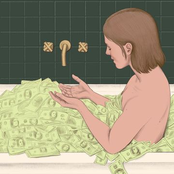 woman in bathtub full of money