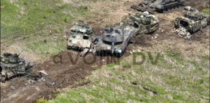 disabled leopard 2a6 tank and bradley armored vehicles near mala tokmachka, ukraine