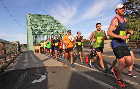Runners at the Bay State Marathon on the Tyngsboro Bridge.