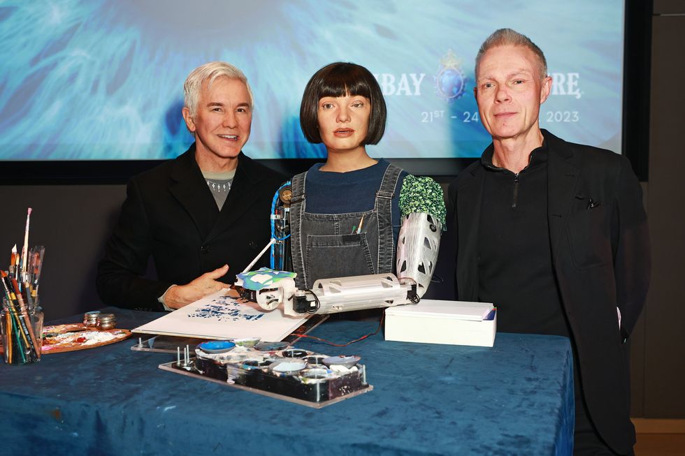 london, england april 19 l to r baz luhrmann, ai da robot and tim marlow attend the launch of the bombay sapphire "saw this, made this" installation created in collaboration with baz luhrmann at the design museum london on april 19, 2023 in london, england the installation will be open to the public from 21st to 24th april 2023 pic credit dave benett