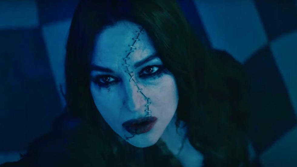 monica belucci's dolores looks up with a look of revenge on her stitched face in a scene from beetlejuice beetlejice