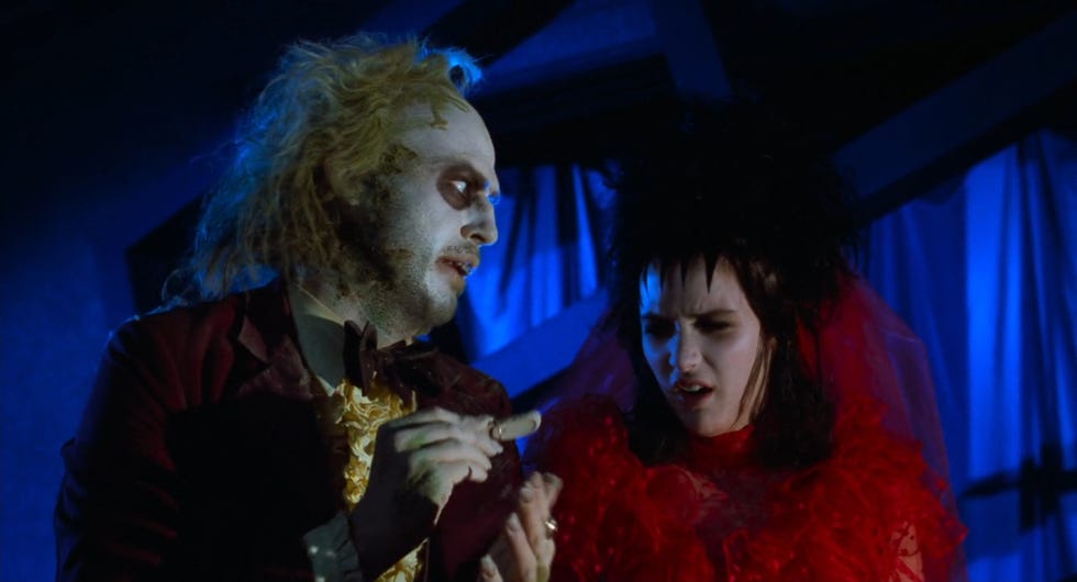 betelgeuse holds a severed finger out to a disgusted lydia in a scene from the original betelgeuse