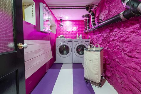 laundry, pink brick wall, neon sign, purple and white stripped floor