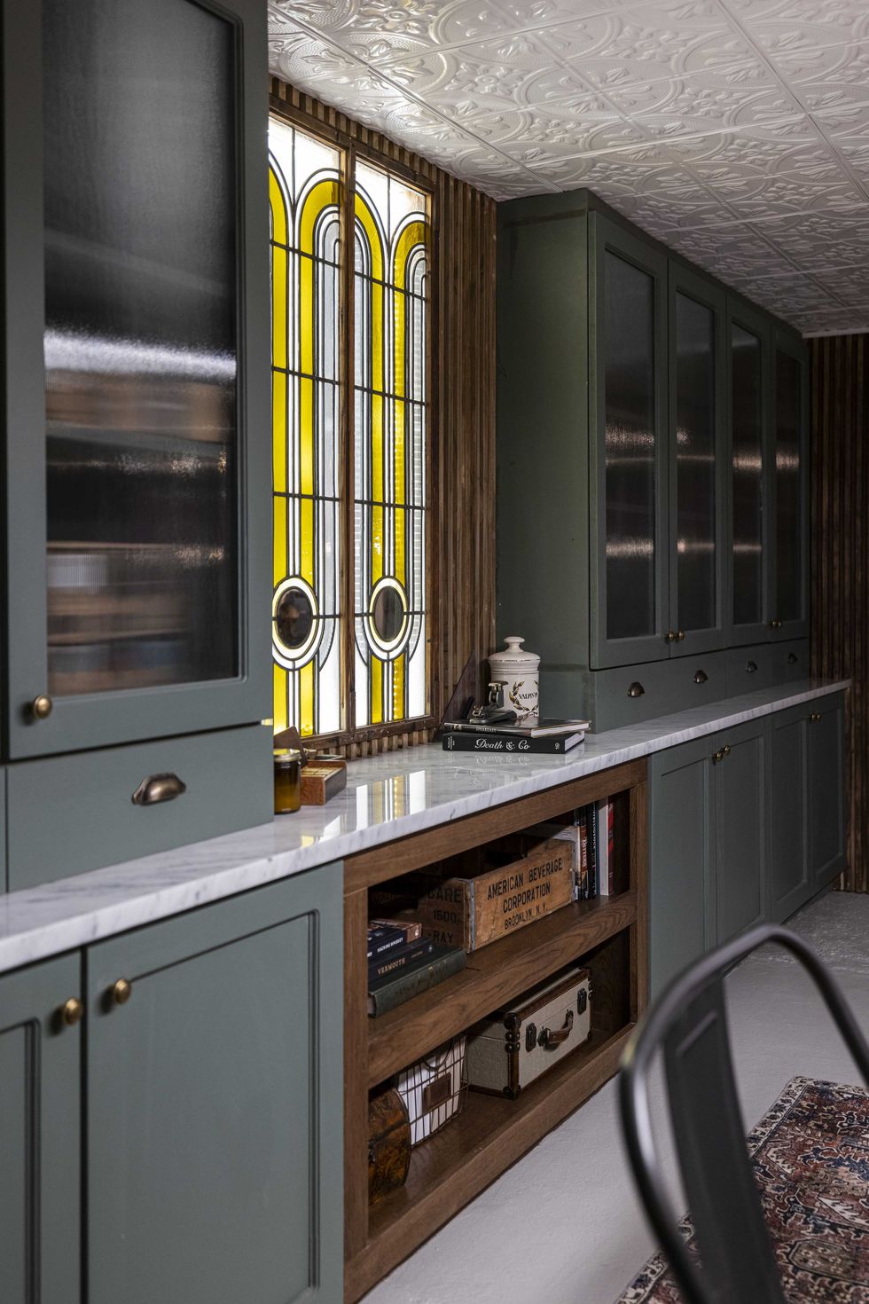 green speakeasy with marble countertops