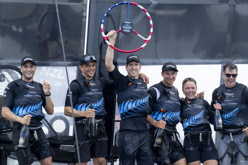 peter burling, co ceo and driver of new zealand sailgp team, lifts the trophy as the new zealand sailgp team celebrate with barons de rothschild champagne on board their f50 catamaran after winning the mubadala new york sail grand prix in new york, usa sunday 23rd june 2024 photo bob martin for sailgp handout image supplied by sailgp