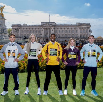 athletes posing in front of a historic building showcasing athletic wear athletes posing in front of a historic building showcasing athletic wear