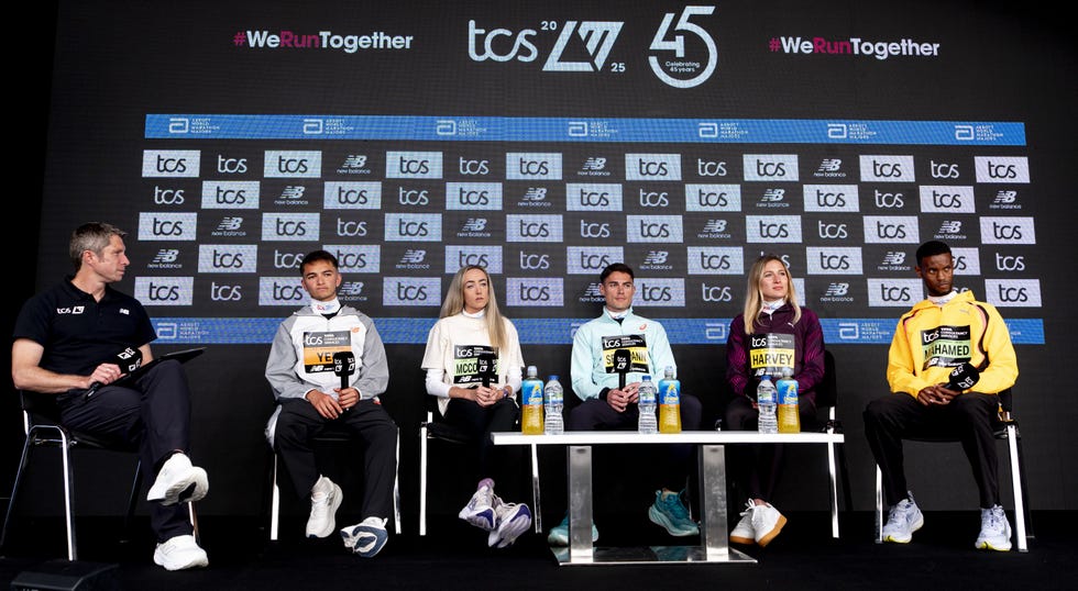 athletes on a panel discussing a running event