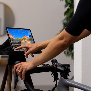 a person on a bicycle using a laptop for fulgaz