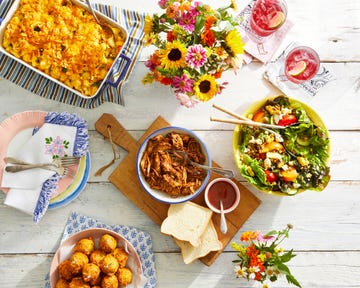 an array of barbecue side dishes on a table, with barbecue