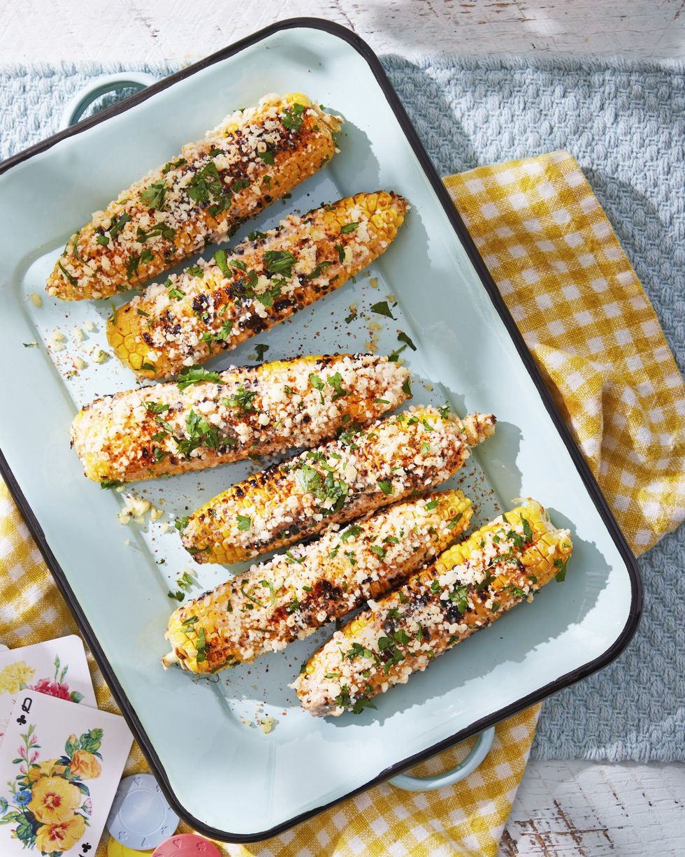 mexican street corn on a light blue serving tray
