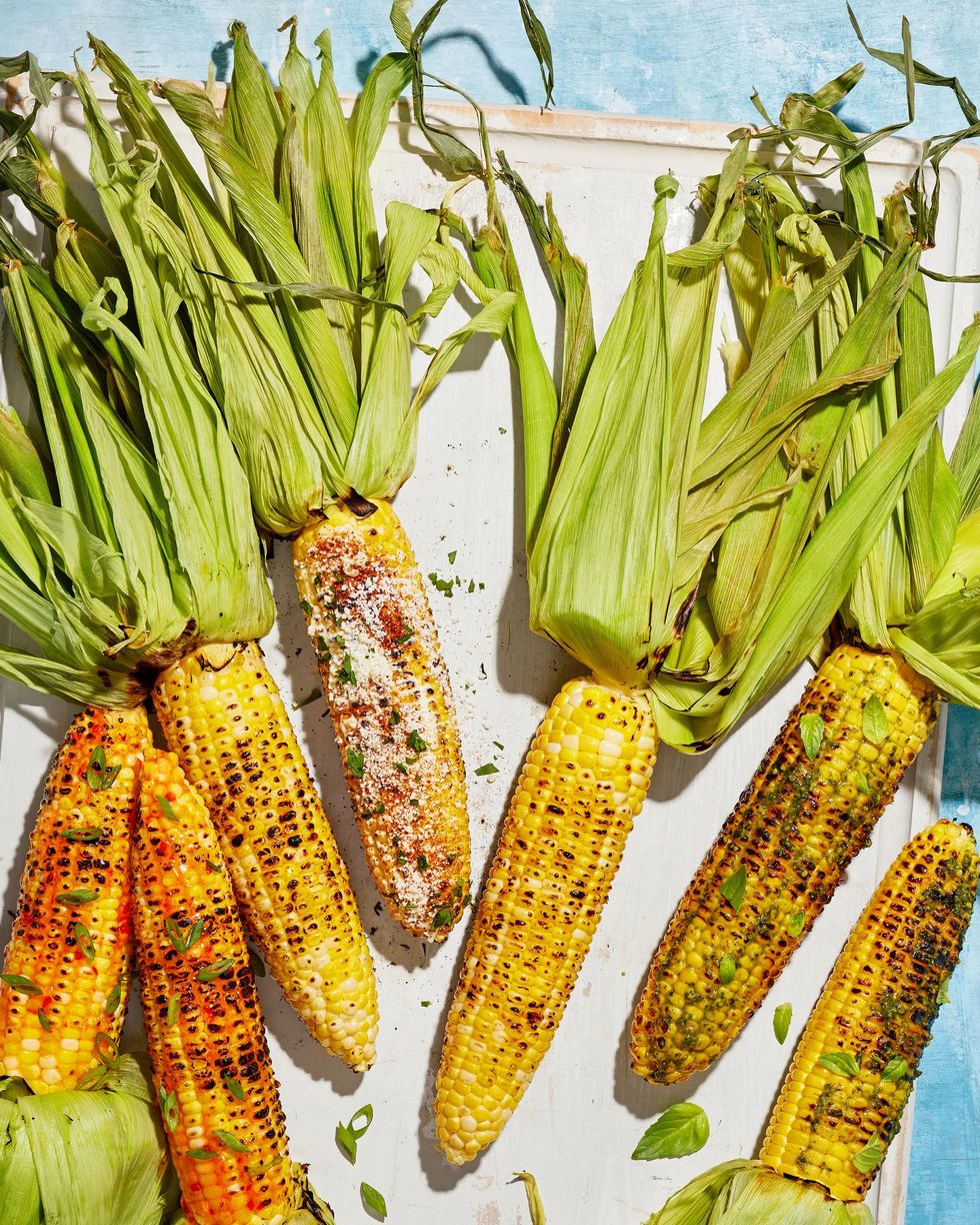 grilled corn three ways on a white serving board