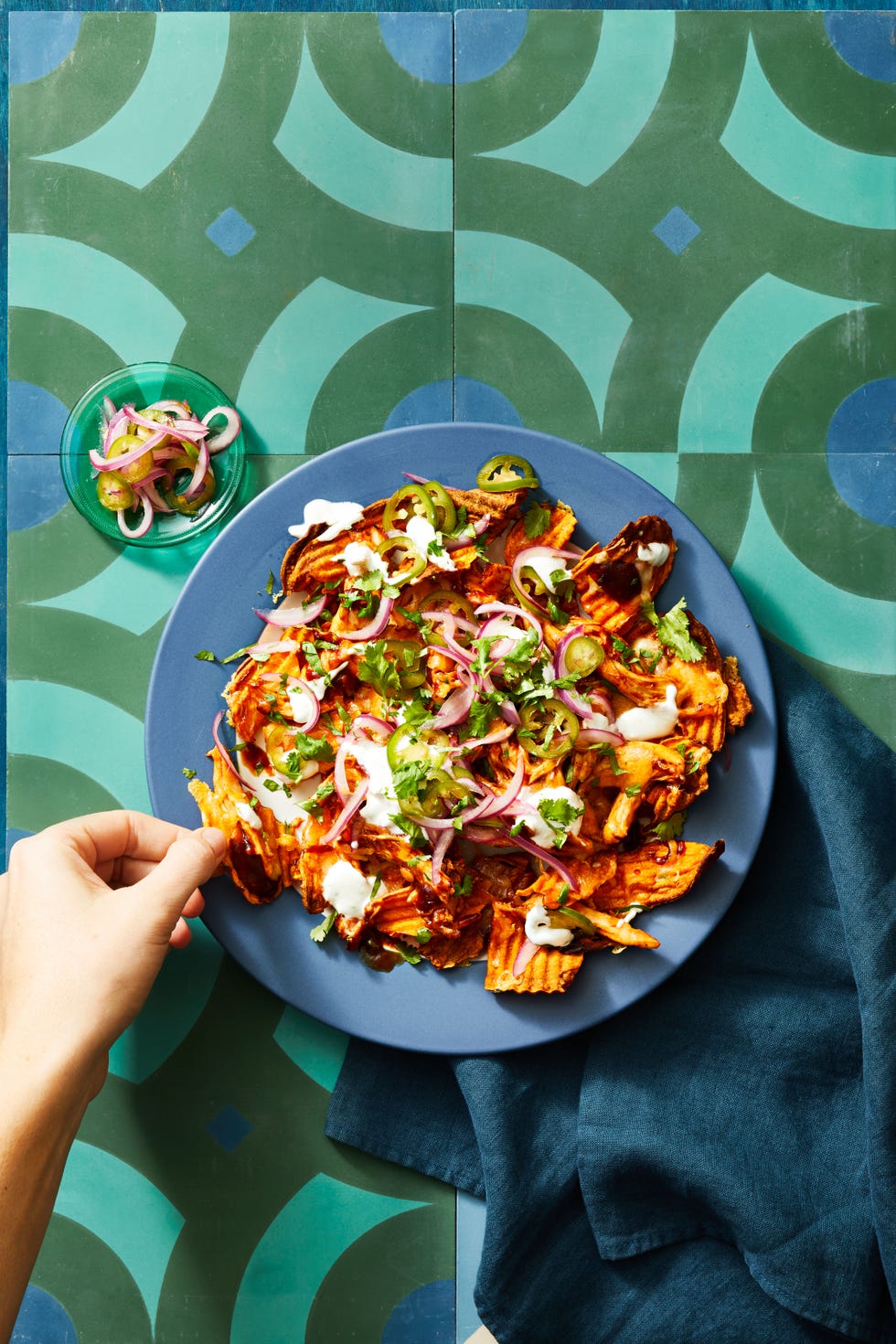 bbq chicken sweet potato nachos on a blue plate
