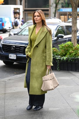 katie holmes in green coat and jeans