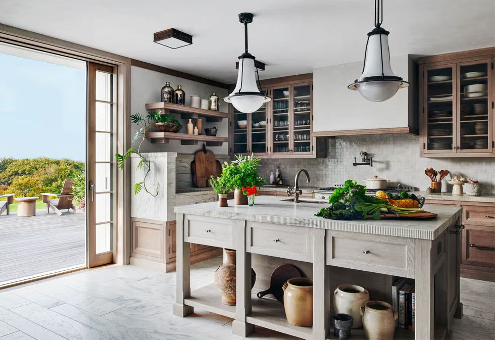 modern kitchen with wooden cabinets large island and outdoor views