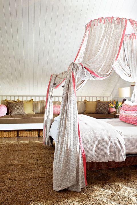 canopy bed with coral pillow
