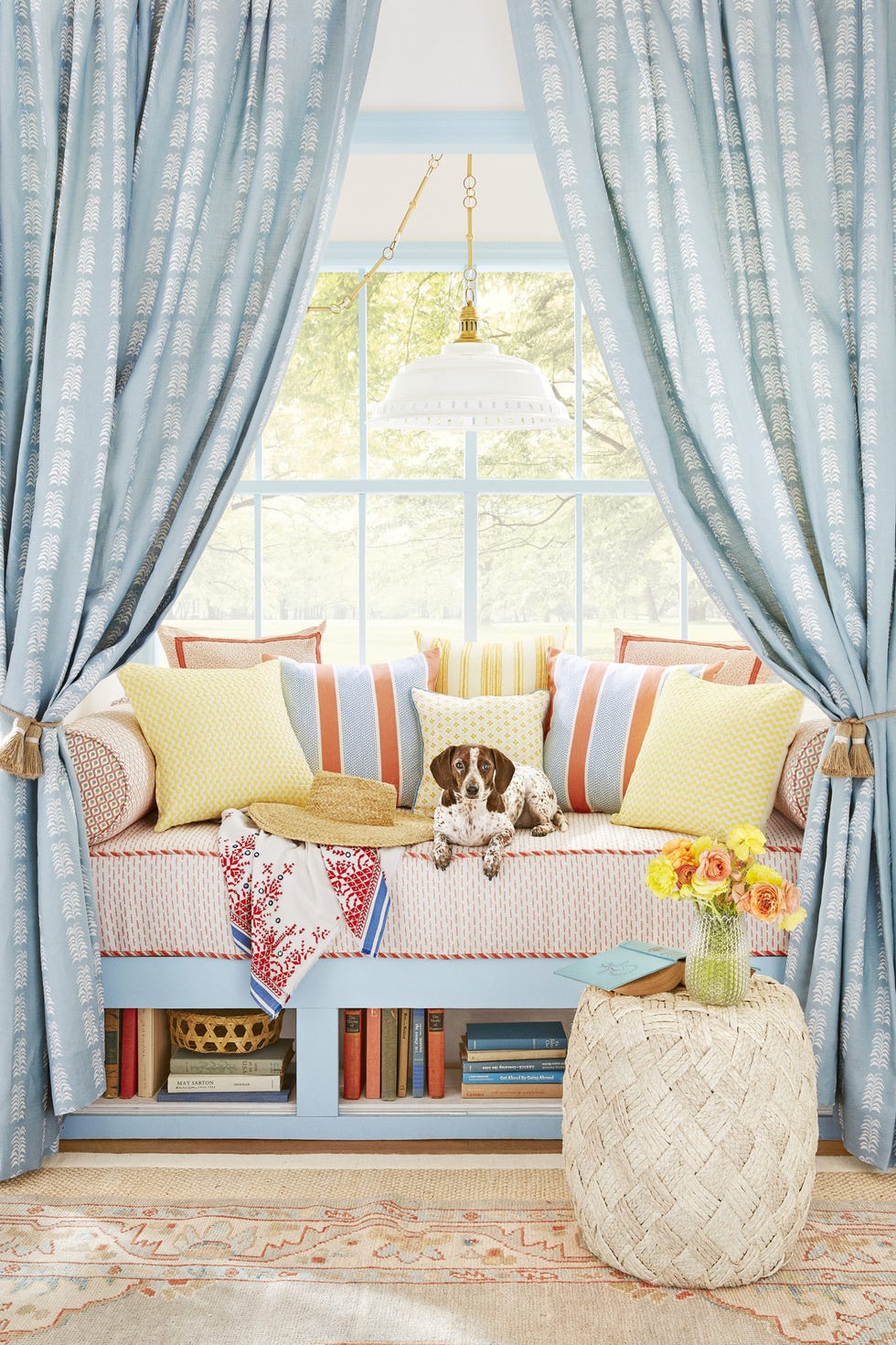 window seat with blue patterned curtains