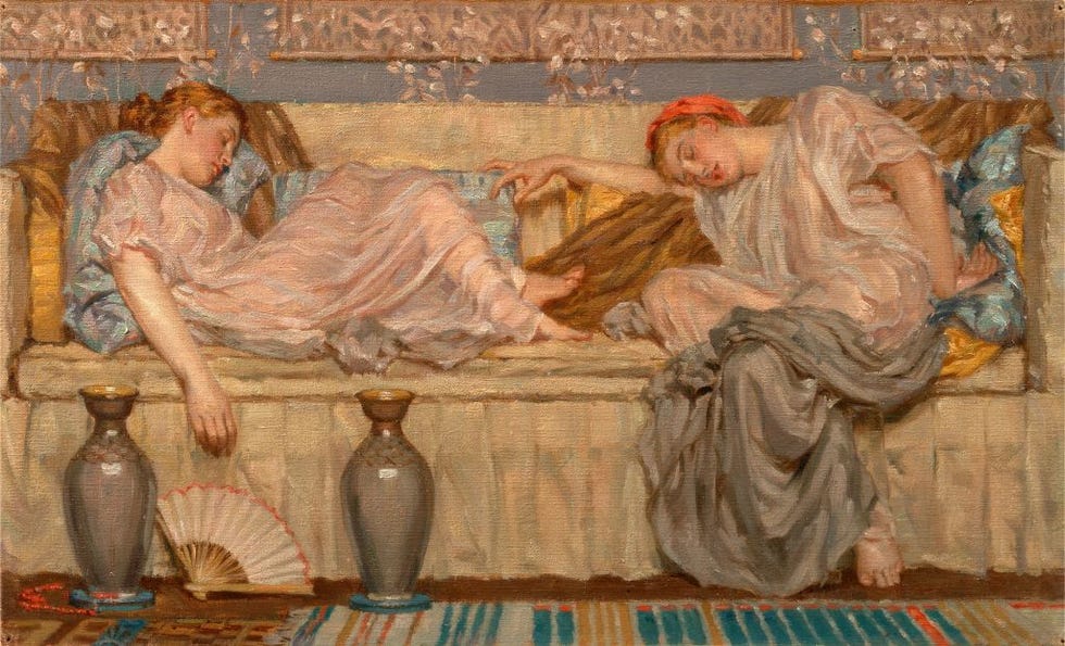 beads study two women on a sofa