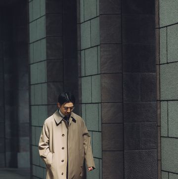 a man wearing a trench coat