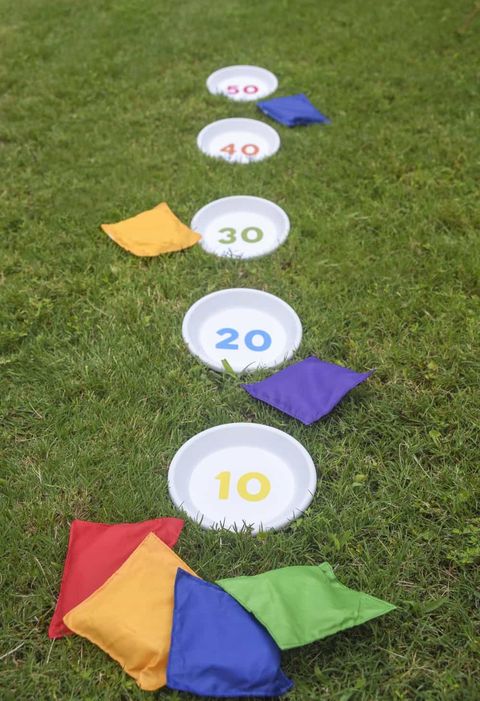 disks with ascending numbers in grass with bean bags