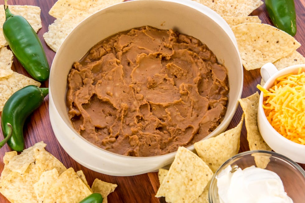 bean dip with jalapenos, sour cream and cheddar cheese