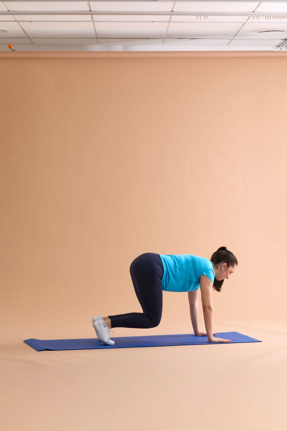 A person performing a workout on a yoga mat