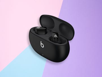 beats studio buds in charging case on a colourful background