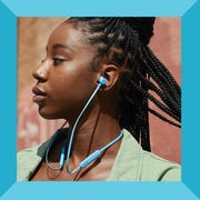 person wearing light blue beats flex wireless earbuds person wearing light blue beats flex wireless earbuds