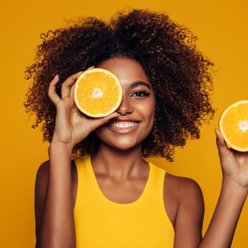 beautiful afro girl with an orange